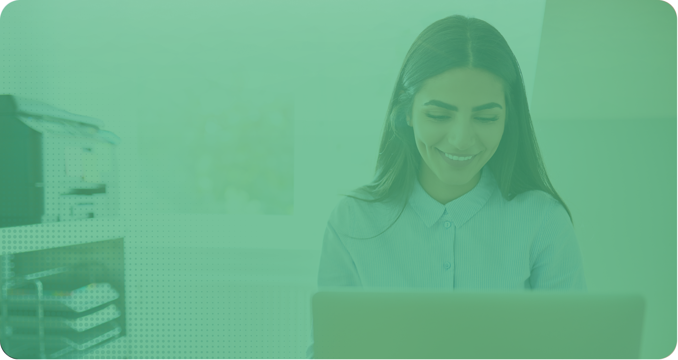 Smiling woman working on a laptop.